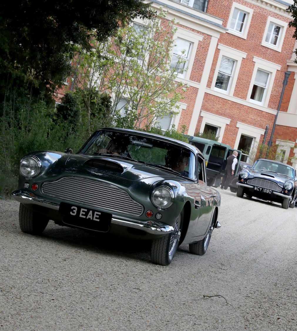 Aston Martin Infront Of House