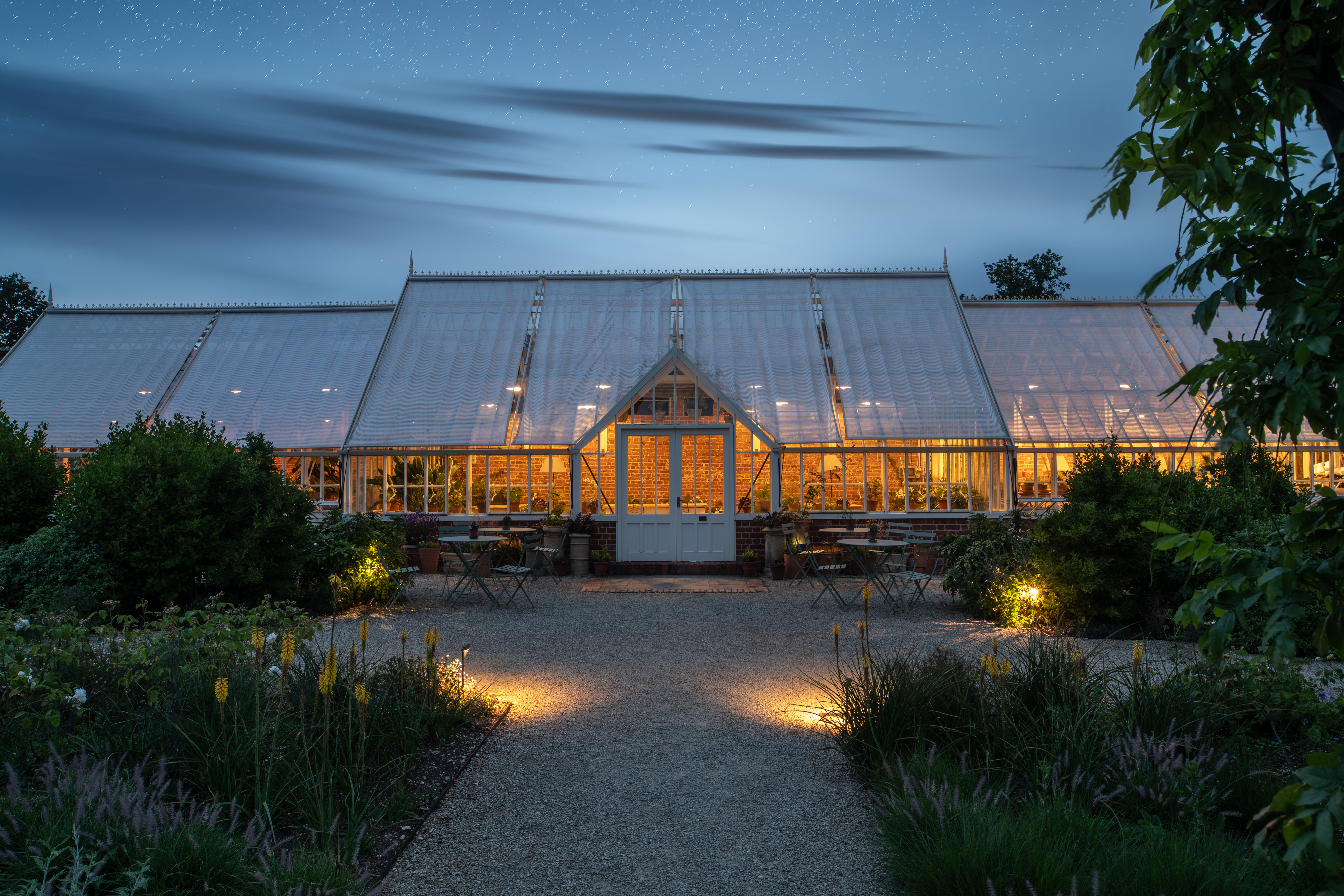 HP Sundown Supper Walled Garden Glasshouse At Night